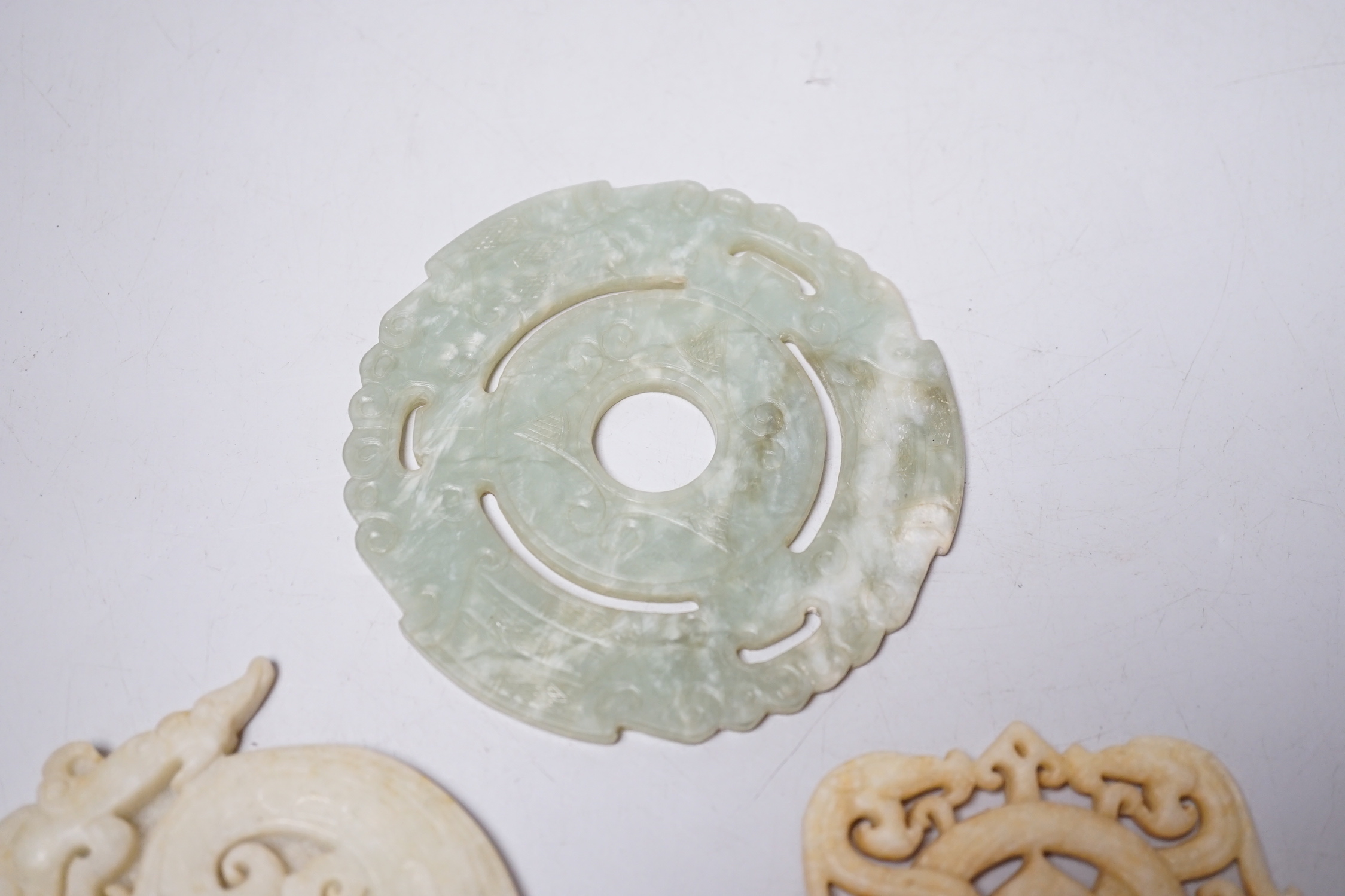 A Chinese bi disc and two other hardstone carvings